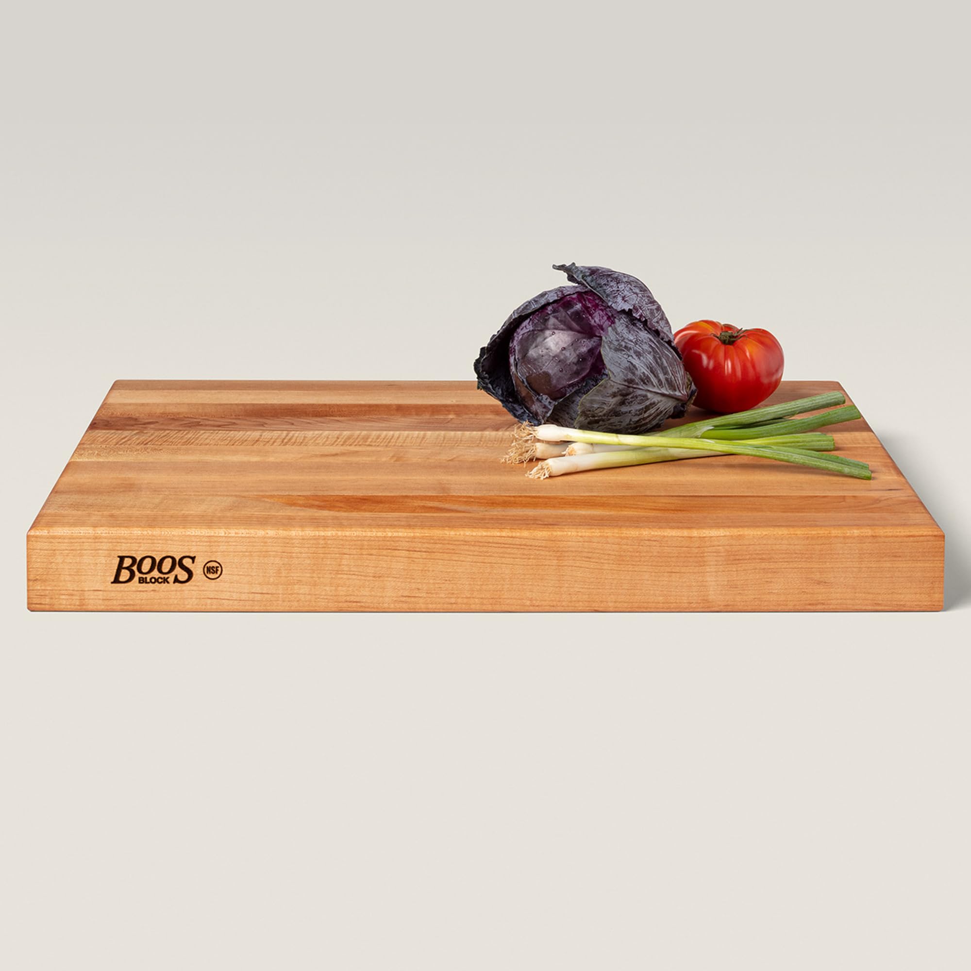 John Boos RA-Board charcuterie display on a wooden backdrop.