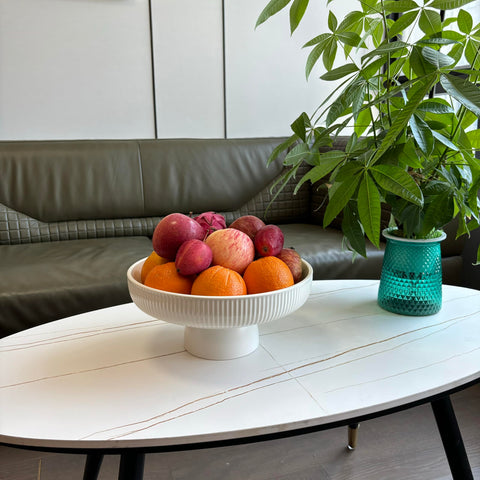 JolieJulie decorative bowl holds fruit and snacks neatly on a shelf.