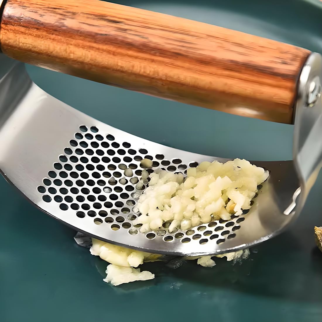 JOMIHONEY garlic press with bottle opener function for added kitchen convenience.
