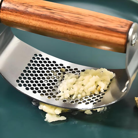 JOMIHONEY garlic press with bottle opener function for added kitchen convenience.
