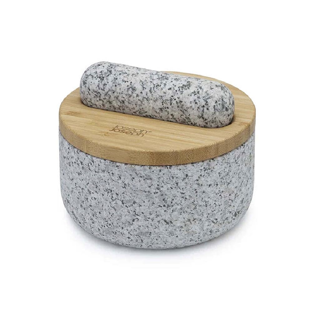Joseph Joseph Dash pestle mortar set with bamboo lid in gray, ready for grinding spices.
