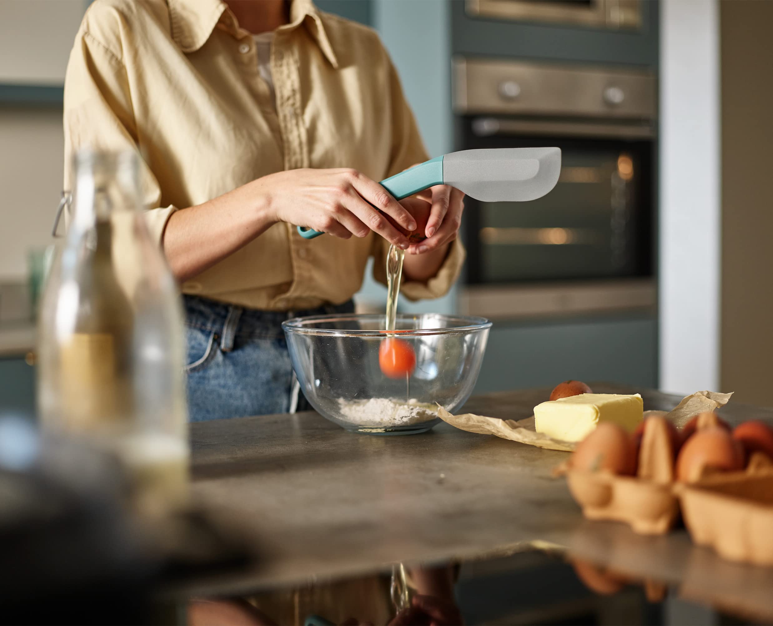 Joseph Joseph Duo silicone spatula features a soft head for gentle scraping.