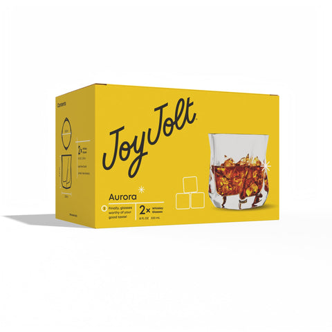 JoyJolt Aurora crystal glasses with bourbon on the rocks, savor the aroma.
