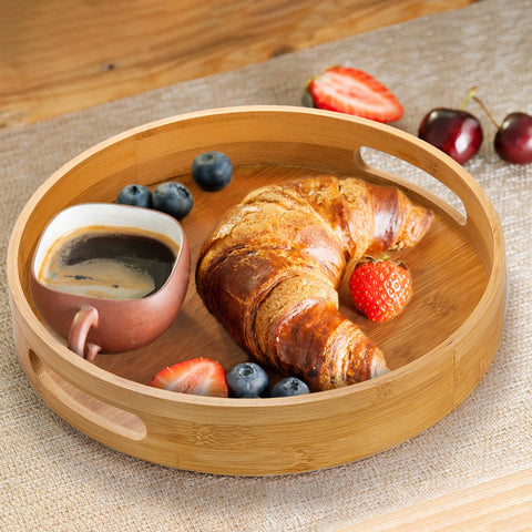 Jucoan bamboo round tray complements any decor on a coffee table.