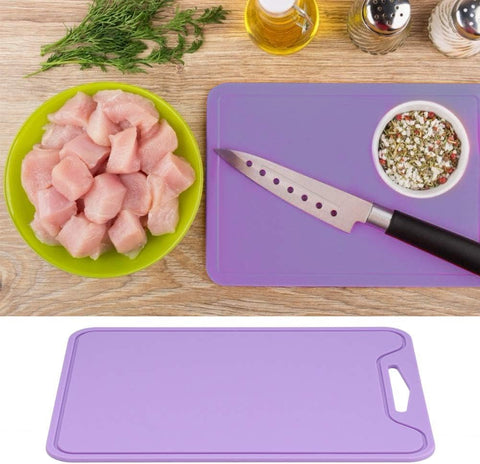JUSTHERE cutting board features hanging holes for compact kitchen storage.