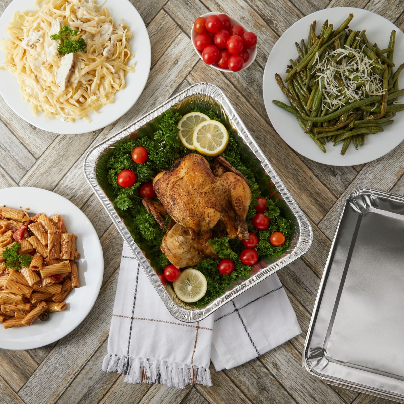 Juvale disposable foil pans with lids, perfect for easy transport of dishes.