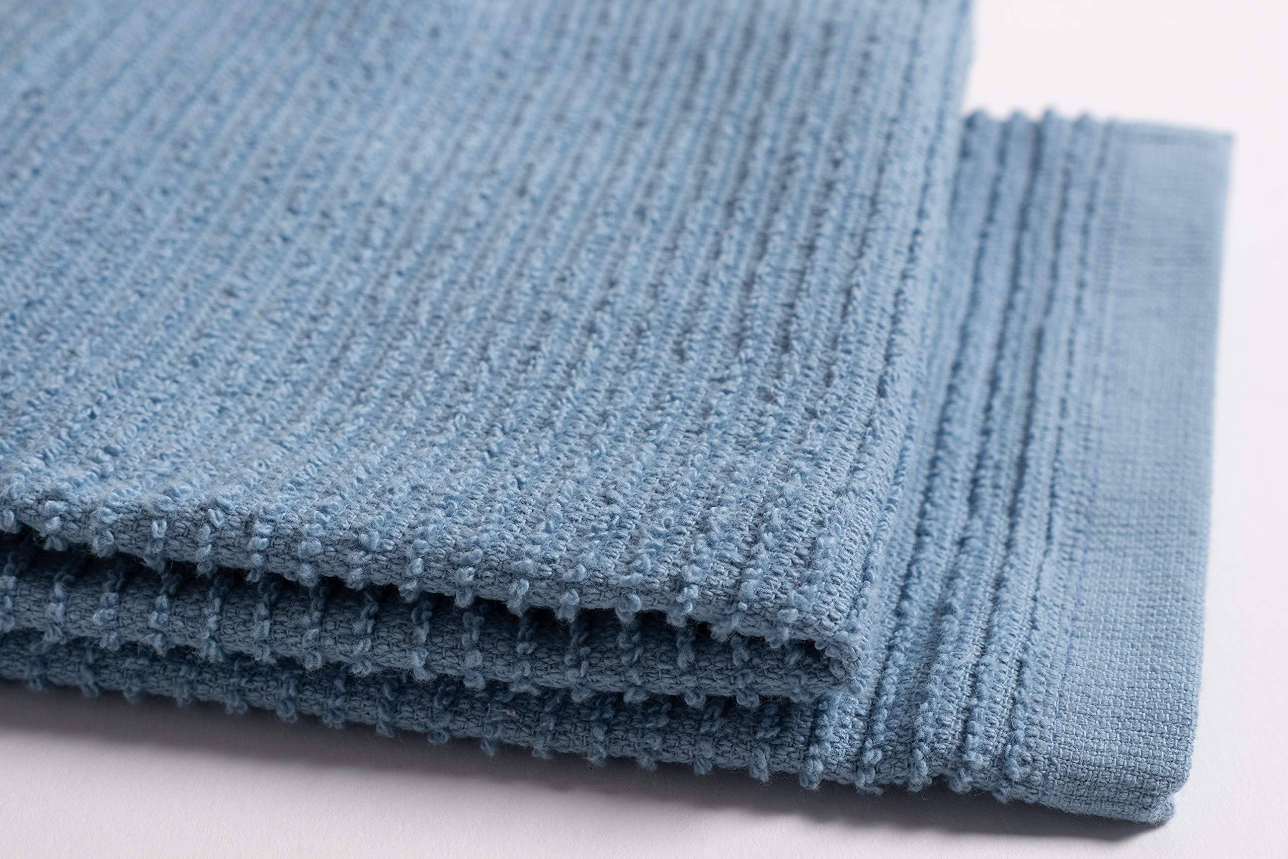 KAF Home 18x28 towels used for drying dishes after washing.