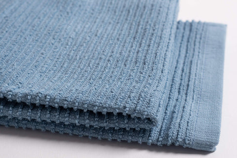 KAF Home 18x28 towels used for drying dishes after washing.