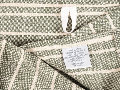 KAF Home olive slubbed kitchen towel wiping countertops and spills efficiently.