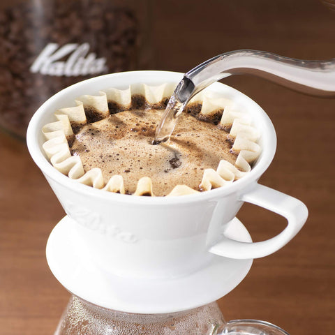 Kalita Wave 185 Lotto in use on kitchen counter for home pour-over rituals.