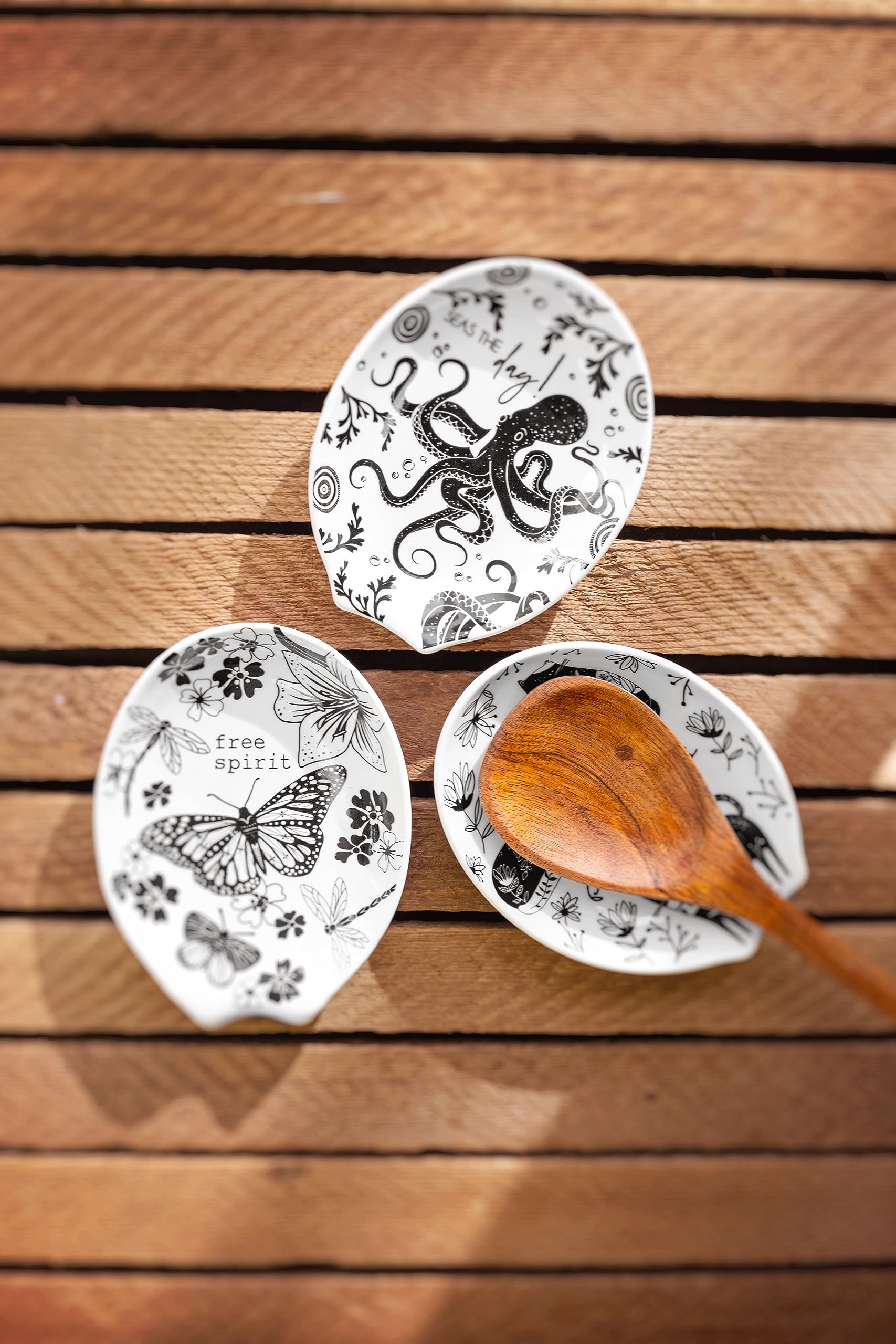 Karma Boho spoon rest on counter beside mugs and towels for a coordinating accent