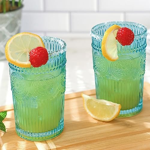 Close-up of embossed aqua glass, grip-friendly for cold drinks.