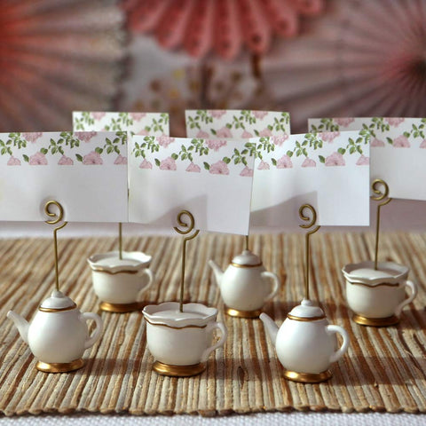 Close-up of teapot card holder with gold stem by Kate Aspen