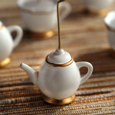 Wedding table decor using Kate Aspen Tea Time Whimsy