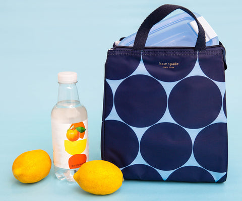 kate spade new york Joy Dot lunch bag with flat base stands steady on countertops.
