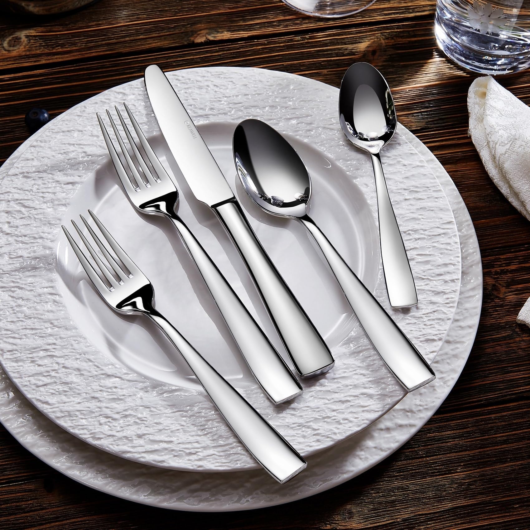 Sleek squared-edge Louis spoon in a stylish dining setup