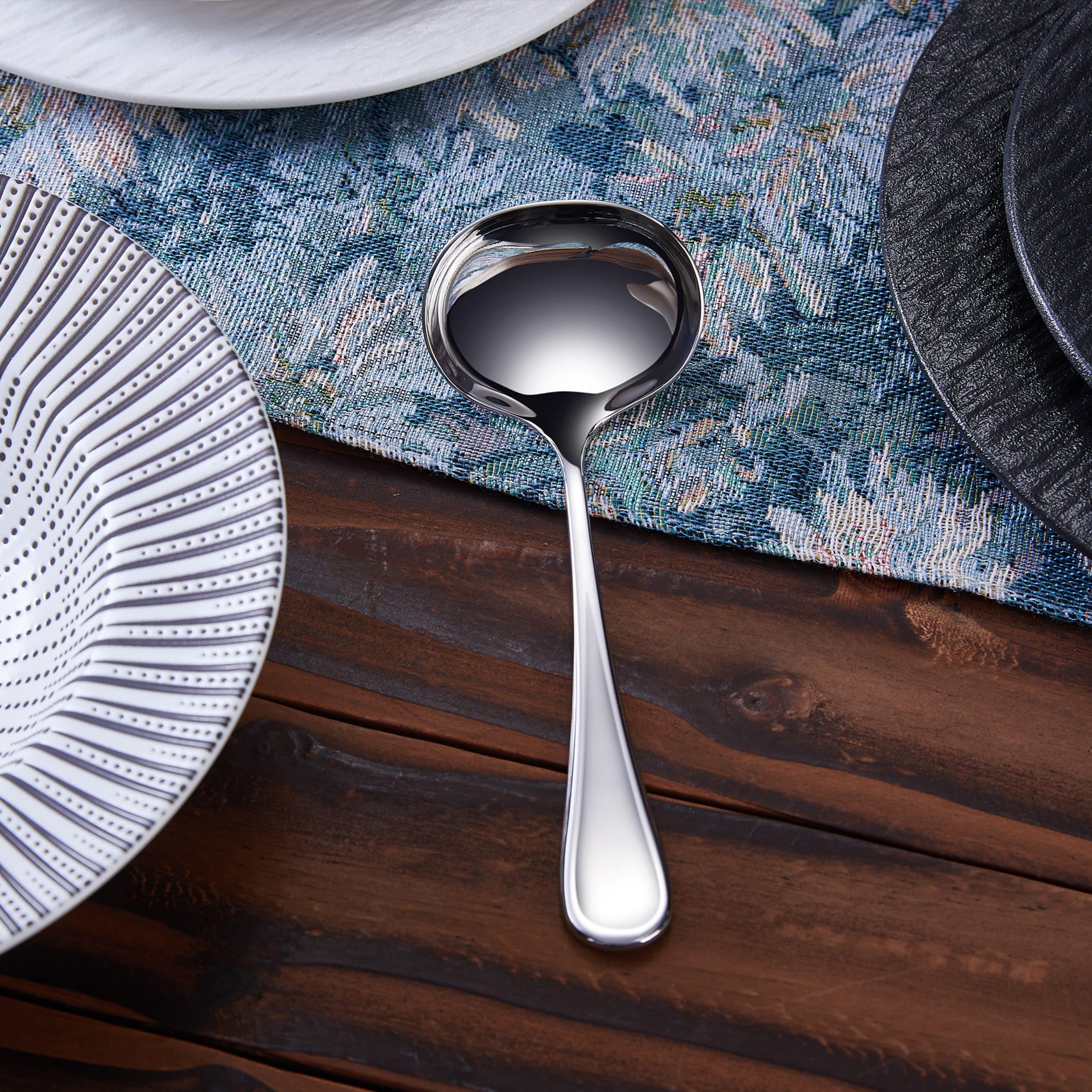 KEAWELL Verona gravy ladle shown in a buffet setup for versatile serving.