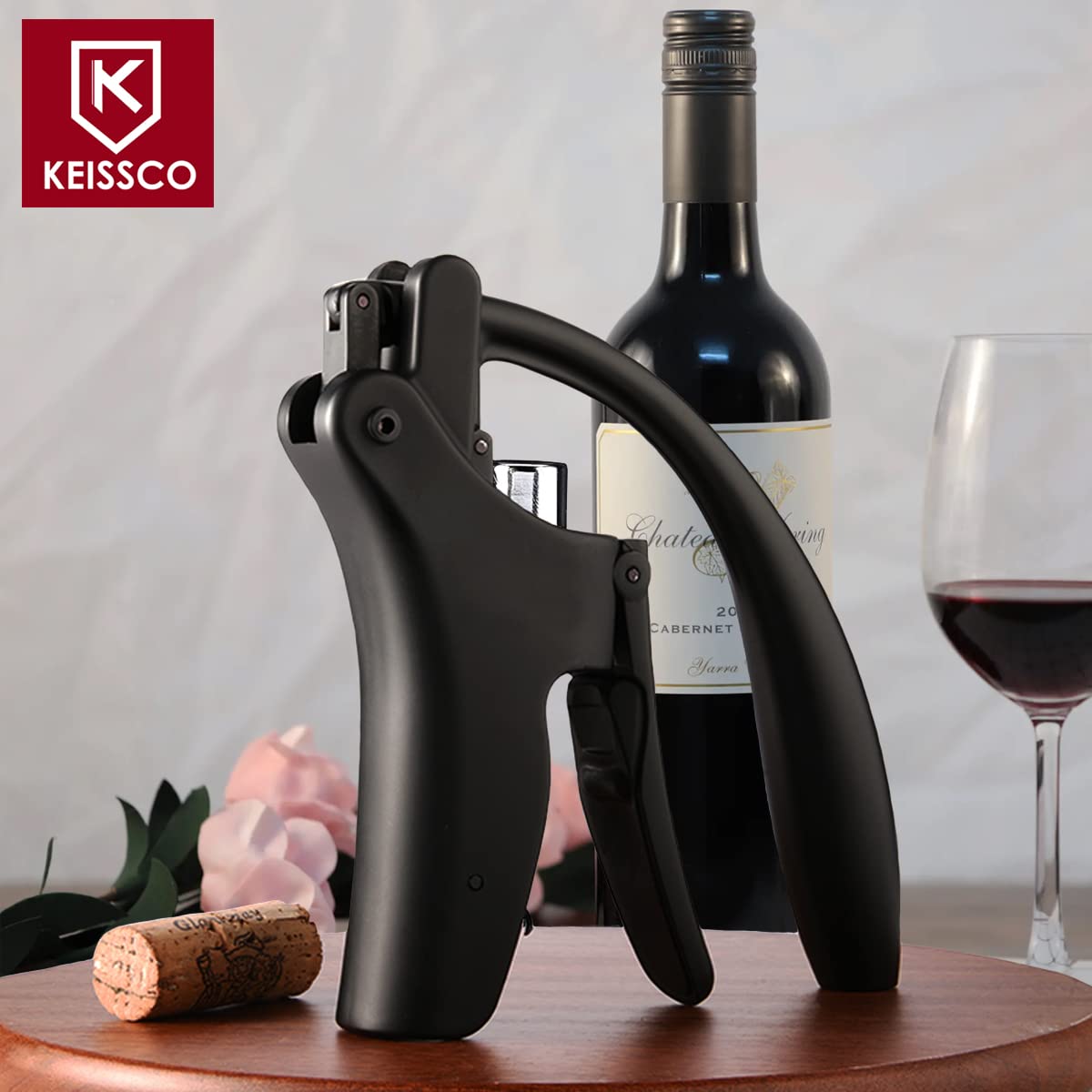 KEISSCO corkscrew in use removing a cork smoothly from a bottle.