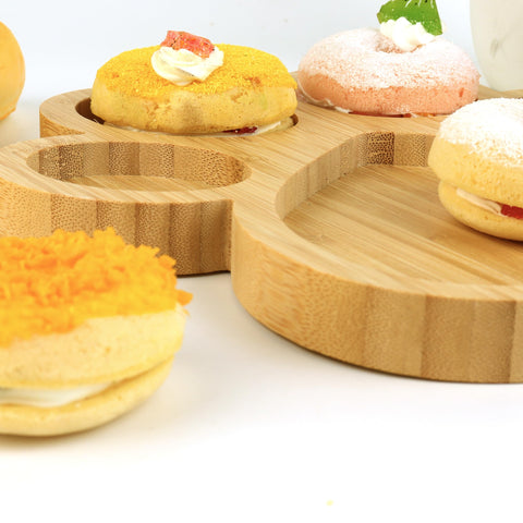 KEPATO bamboo paw tray enhances display of crackers and cheeses.