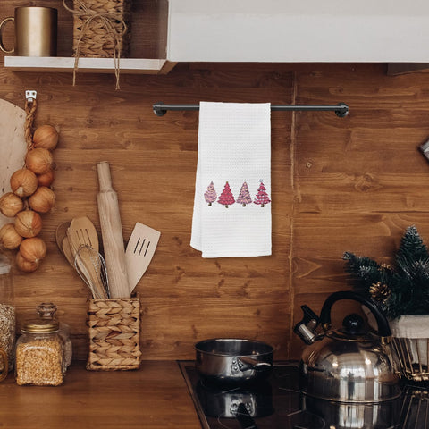 KEUSPI pink Christmas towel hanging on rack beside sink