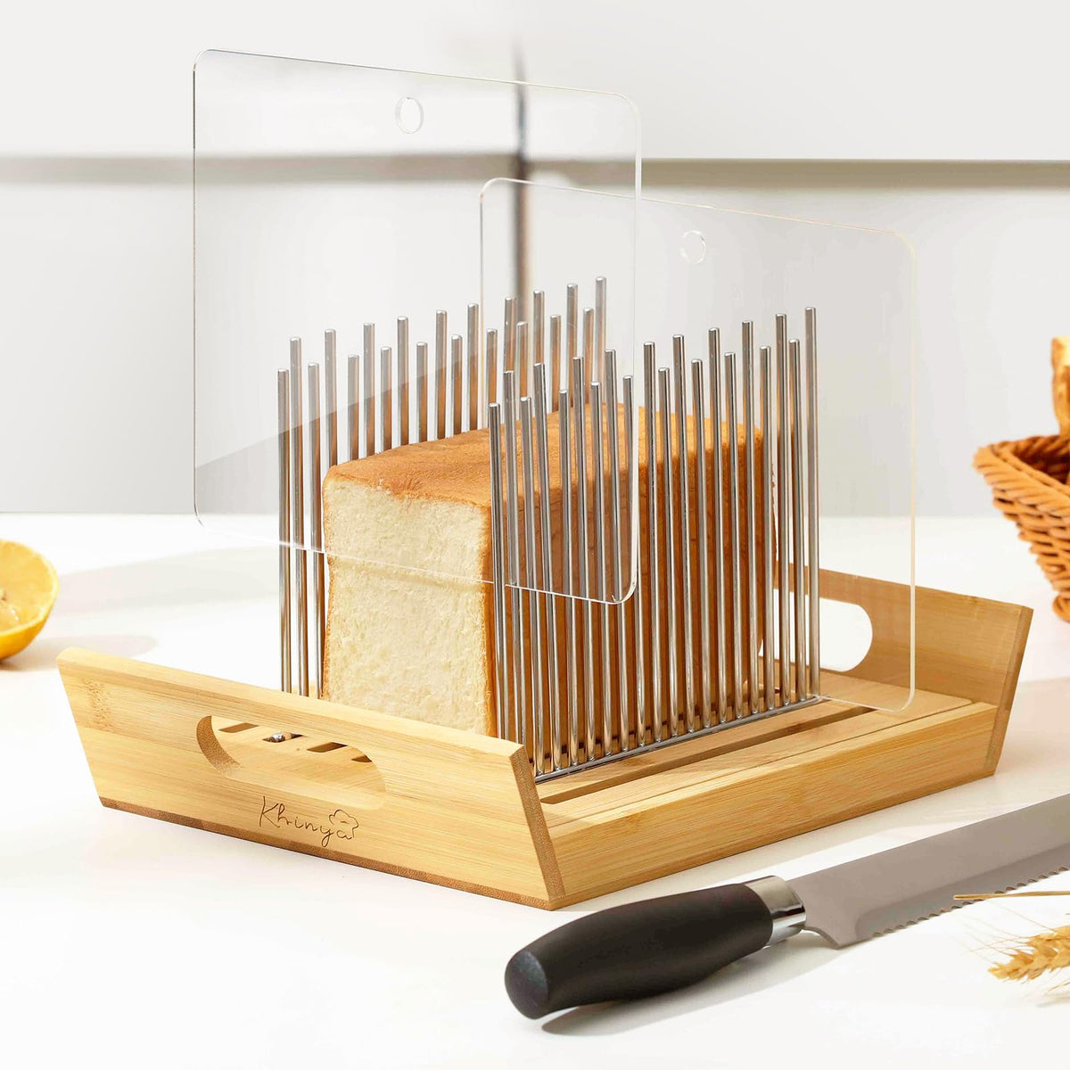 KHINYA bread slicer with boat-shaped tray catching crumbs and serving slices