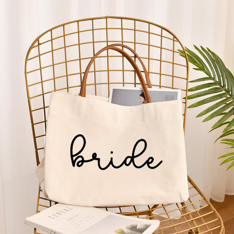 Kifasyo Bride Tote Bag inside pocket keeps phone organized during events.