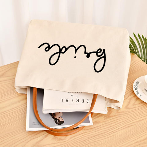 Kifasyo Bride Tote Bag size dimensions indicate roomy capacity for outfits.