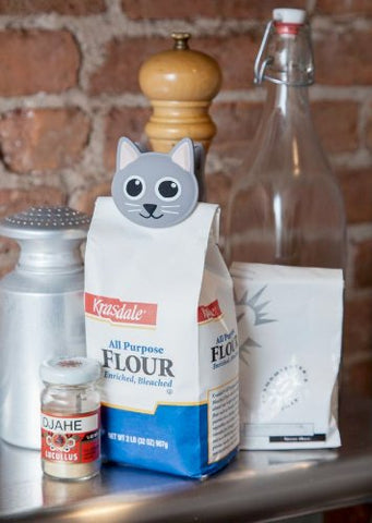 Kikkerland Cat Talking Bag Clip side view shows compact size for pantry storage.