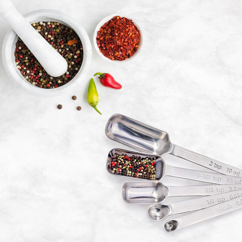 King Arthur spoons with narrow profiles and long handles reach tall jars easily.