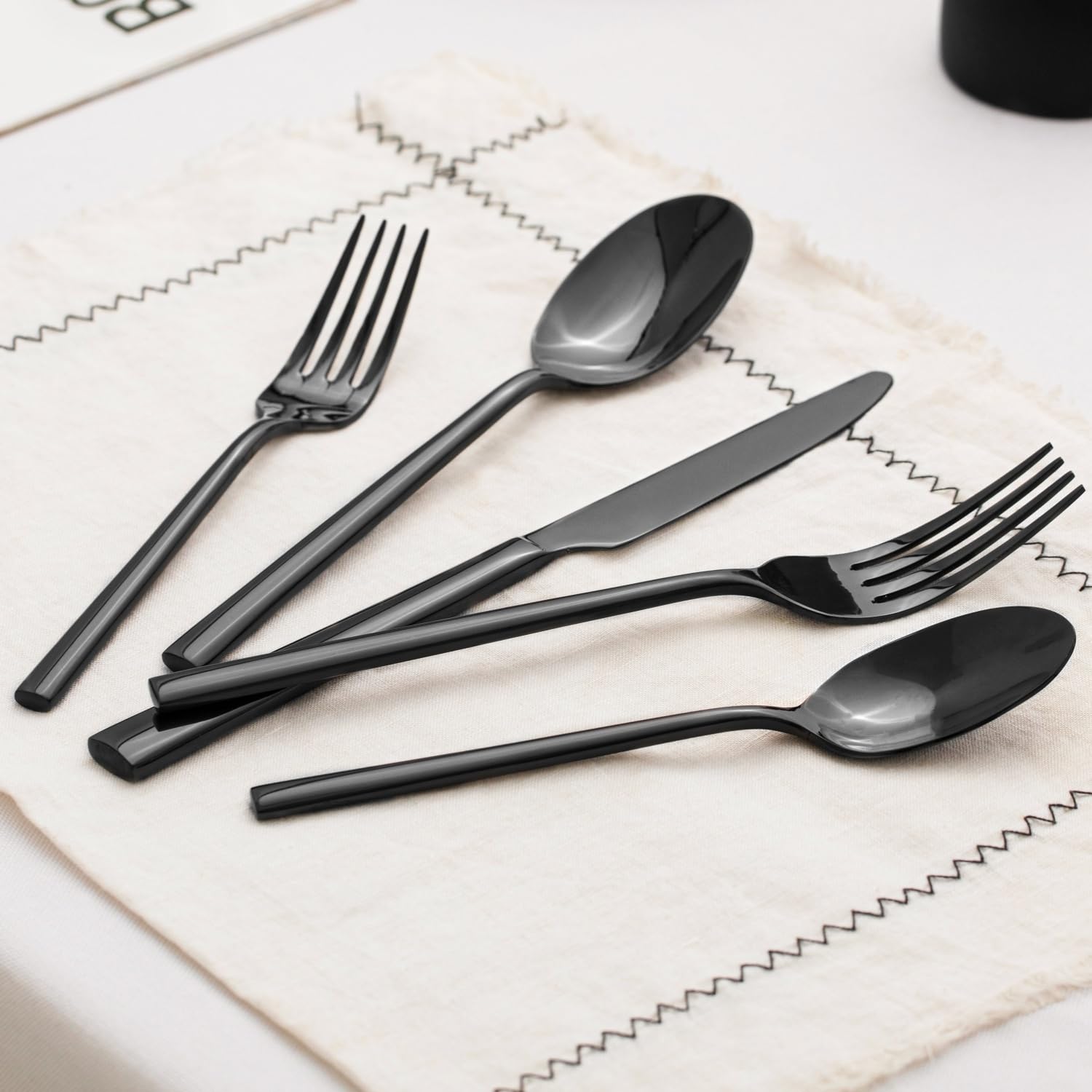 Kingstone dishwasher-safe label on polished flatware for convenient cleanup.