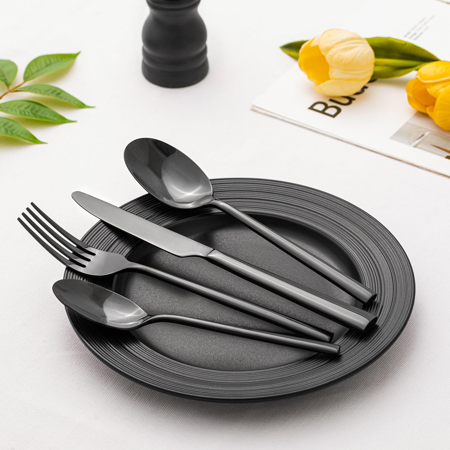 Kingstone black silverware teaspoon in glassware setting for tea service.