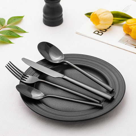 Kingstone black silverware teaspoon in glassware setting for tea service.