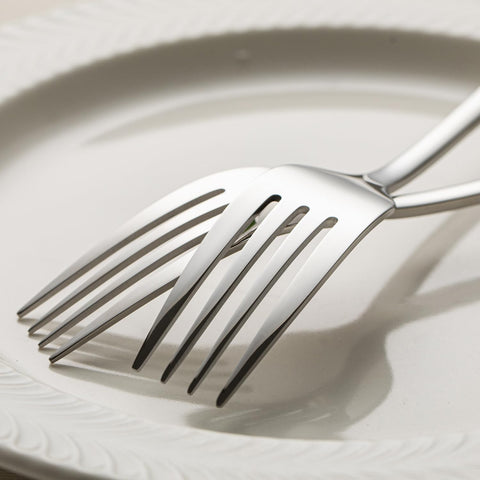 Kingstone dining forks on table showcasing classic silverware styling.
