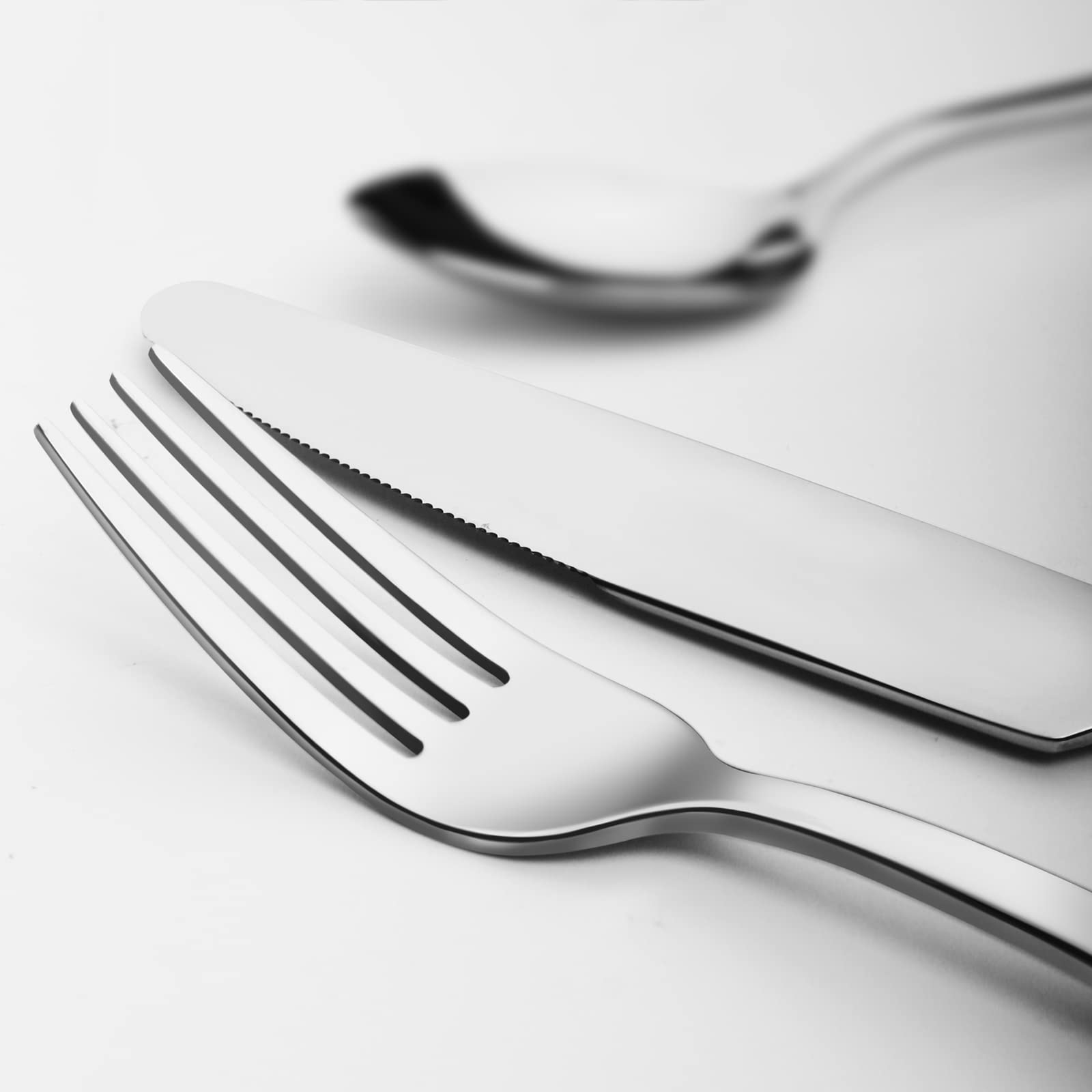 Kingstone dinner forks with mirror-polished finish and smooth edges for comfort.