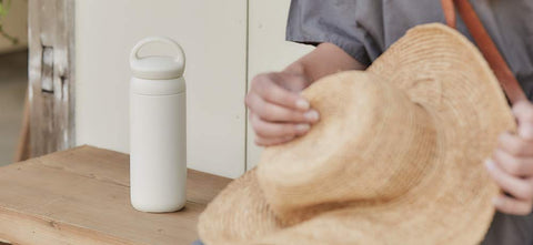 Kinto Day Off white handle closeup showing easy-grip design for travel.