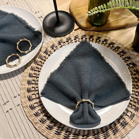 Kintyno twelve-piece napkin ring set arranged for elegant wedding table decor.
