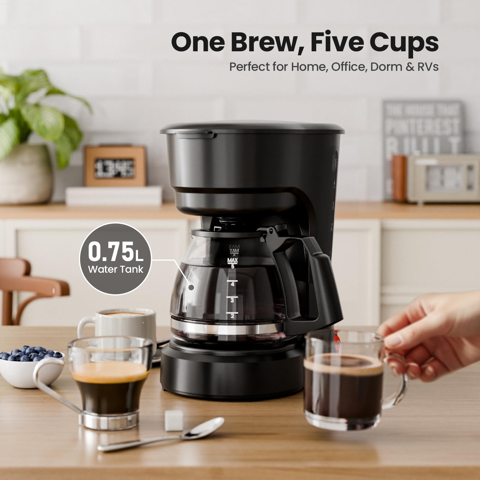 Kismile 5-cup coffee maker during brew pour, highlighting anti-drip feature.
