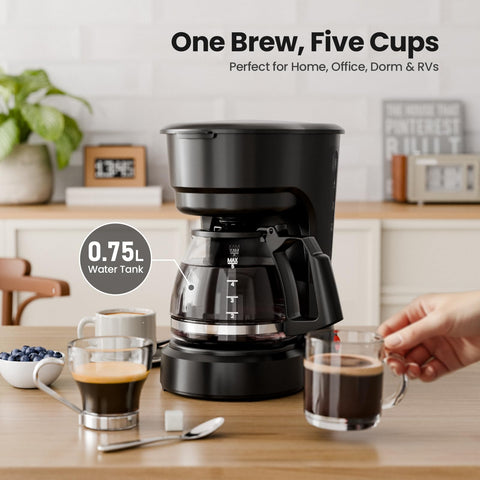 Kismile 5-cup coffee maker during brew pour, highlighting anti-drip feature.