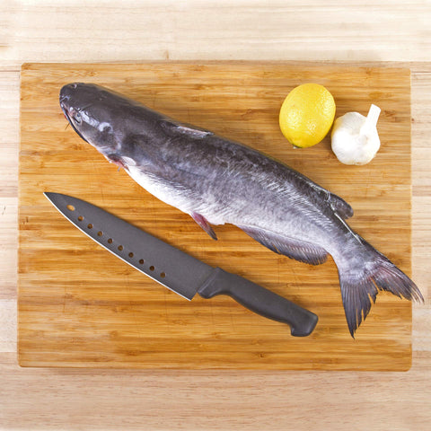 Kitchen Home knife showing ten holes along edge to reduce friction