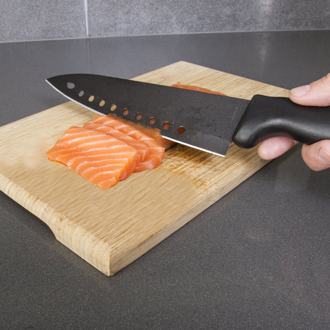 Kitchen Home knife slicing raw fish with minimal sticking