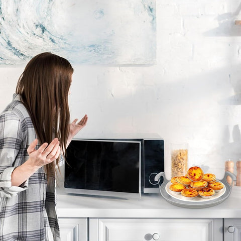 Compact kitchen organization with microwave plate for bowls and plates.