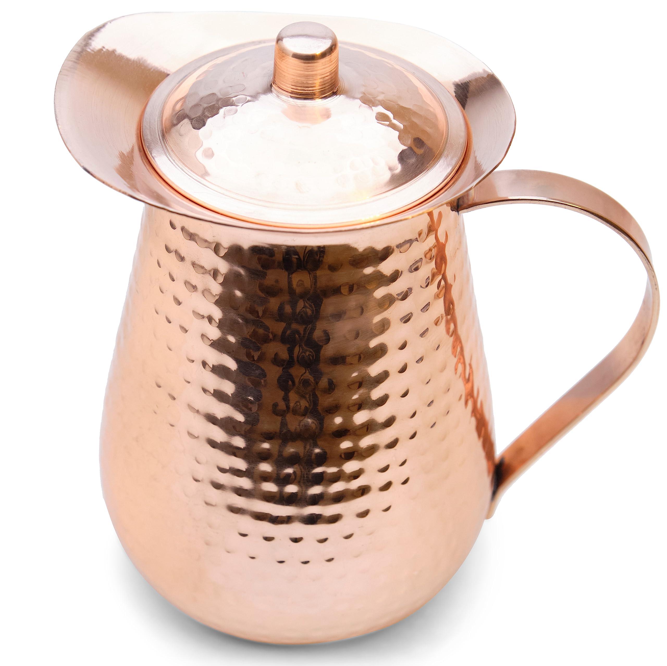 Kitchen Science hammered copper pitcher close-up showcases artisanal craftsmanship.