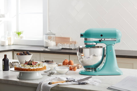 KitchenAid Aqua Sky pouring shield in action helps keep ingredients contained.