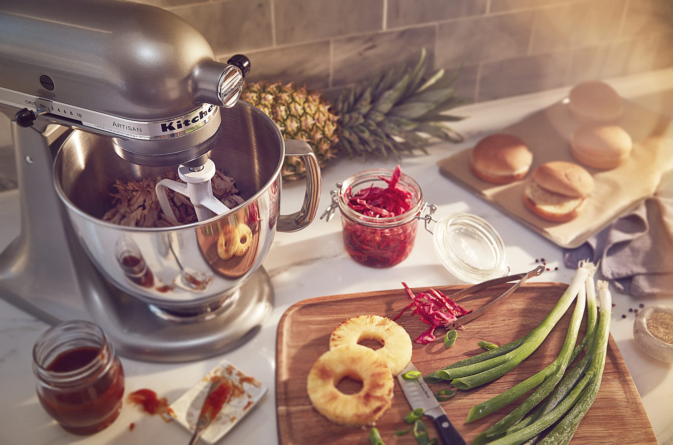 KitchenAid Artisan attachments hub expands kitchen capabilities with extra tools.