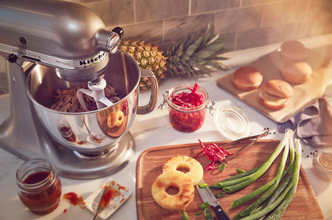 KitchenAid Artisan attachments hub expands kitchen capabilities with extra tools.