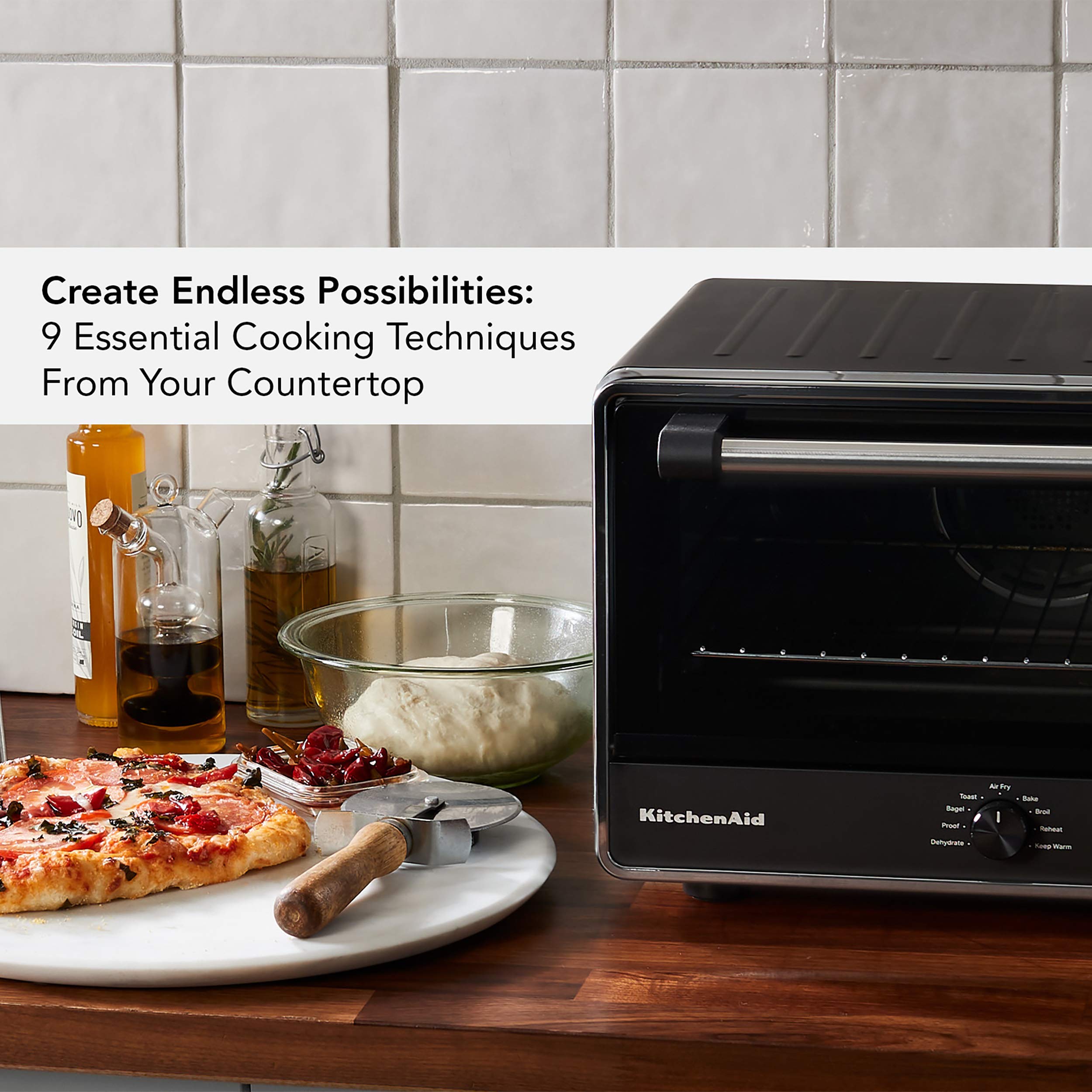 KitchenAid KCO124BM cooks a 12-inch pizza with ample capacity.