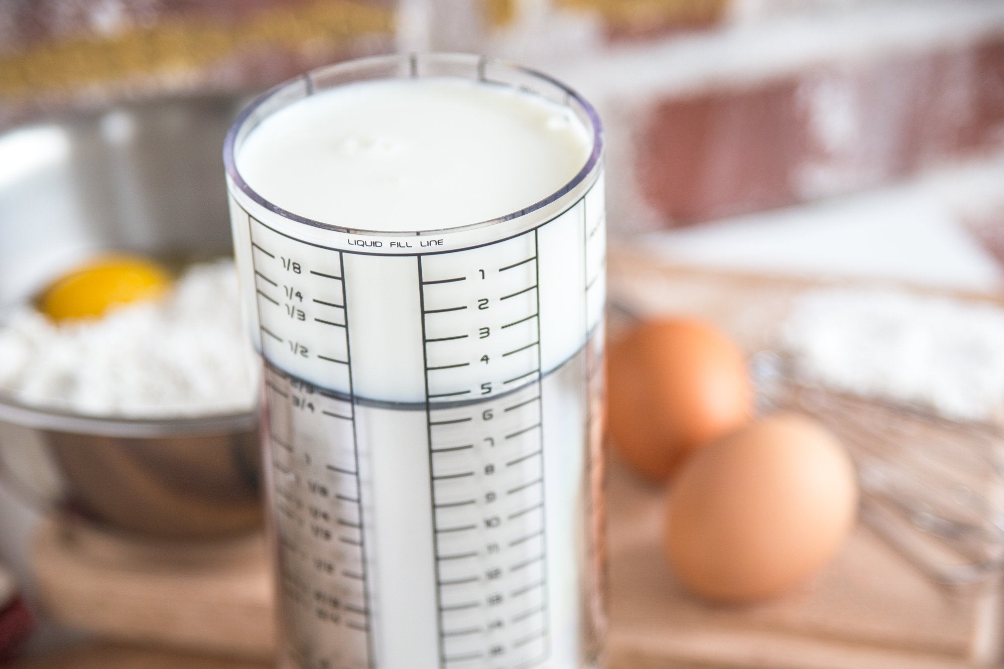 KitchenArt Pro 2-Cup Adjust-A-Cup built from durable ABS SAN and silicone materials.