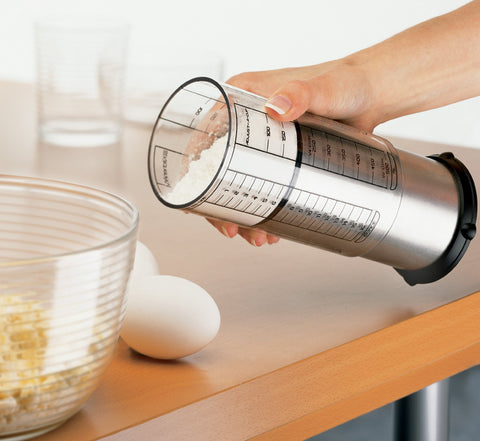 KitchenArt Pro 2-Cup Adjust-A-Cup clear measurement sleeve with metric and US units.
