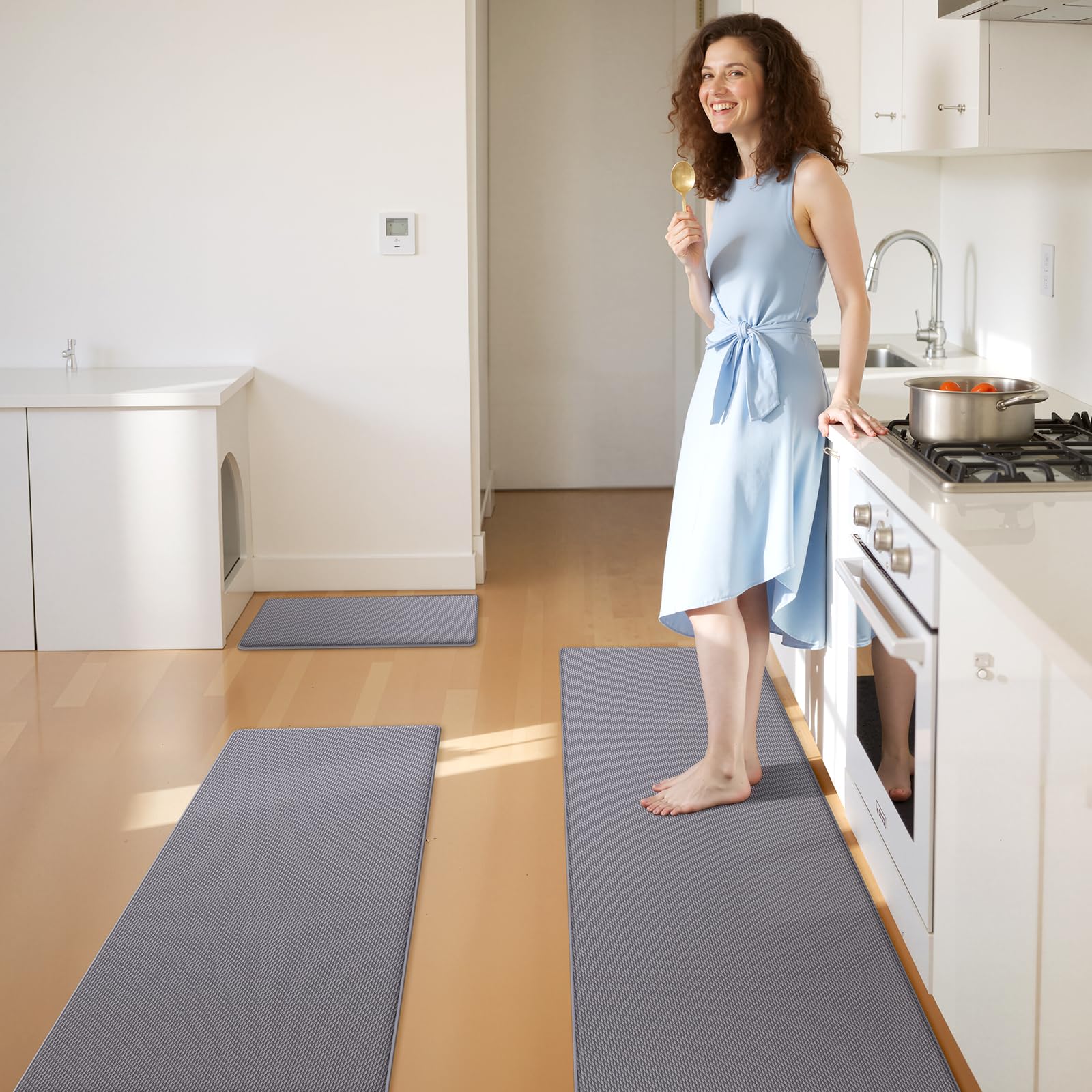 KitchenClouds kitchen mats waterproof surface protects floors from spills and moisture.