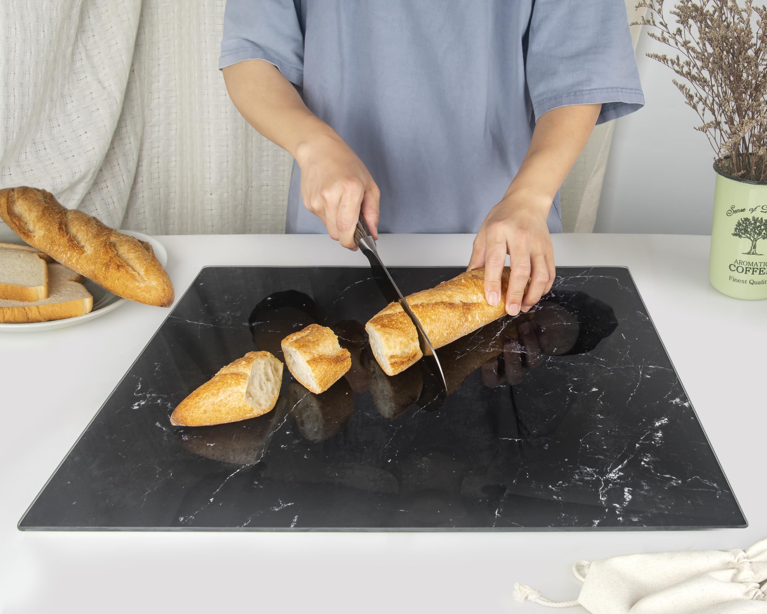Kitchenville glass cutting board heat resistant up to 500°F for hot pans.